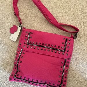 Hot pink studded bag.